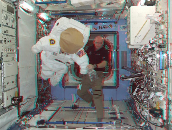 scott-kelly-with-a-spacewalk-suit_5579453244_o.jpg