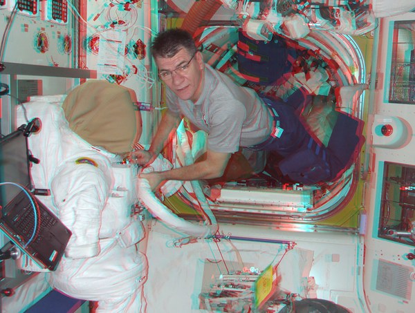 working-on-a-spacewalk-suit-in-the-joint-airlock_5578867057_o.jpg