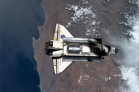 the-iss-casts-a-shadow-on-discovery_5480781411_o.jpg